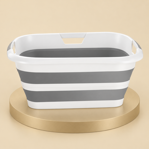 Gray and white collapsible pet bathtub with two flexible wall bands and rim grip openings on a beige platform.