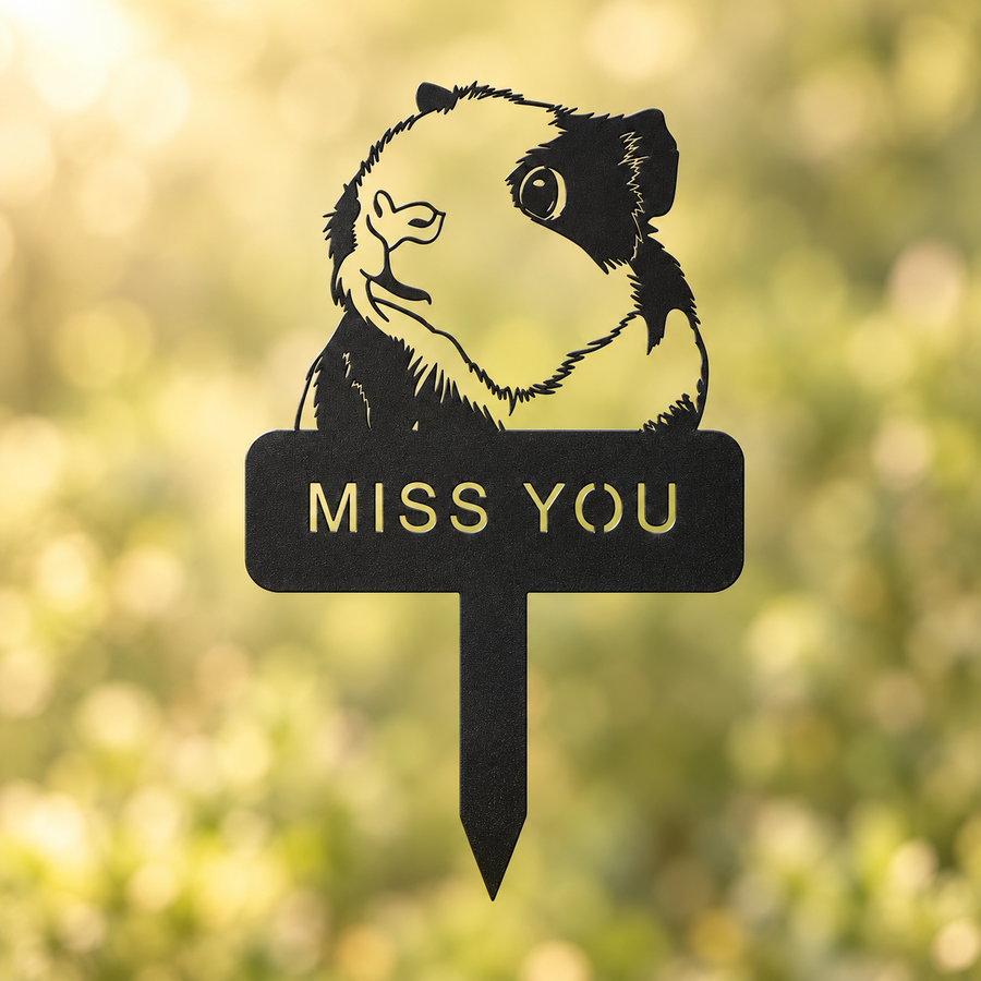 Front view of the guinea pig portrait and cutout MISS YOU inscription on a black metal garden stake