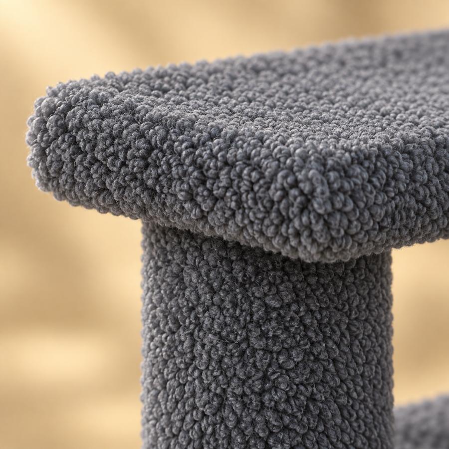 Close-up of curly gray Berber fleece on a cat stair step and its post support