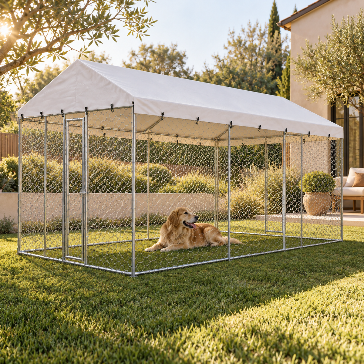 Golden retriever lying on the grass inside a covered chain-link outdoor dog kennel with a white canopy roof