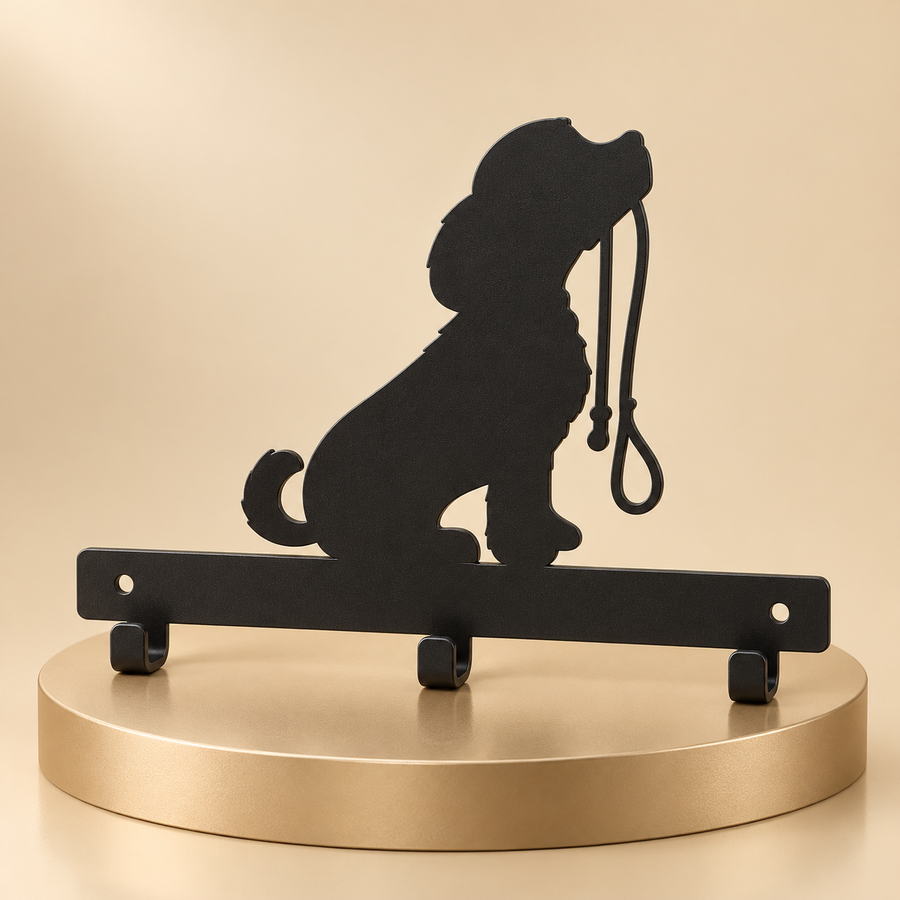 Black three-hook leash rack with a seated dog silhouette displayed upright on a champagne plinth