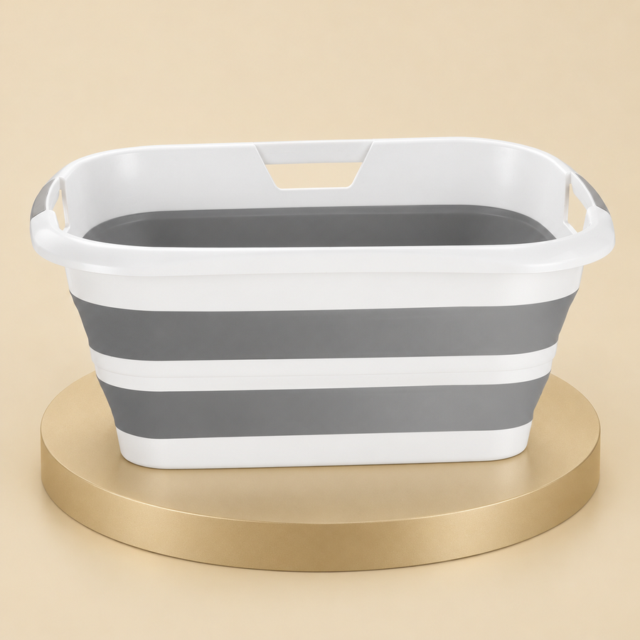 Gray and white collapsible pet bathtub with two flexible wall bands and rim grip openings on a beige platform.