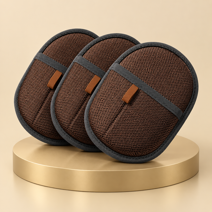 Three dark brown pet hair mitts with tan loops arranged on a round gold plinth