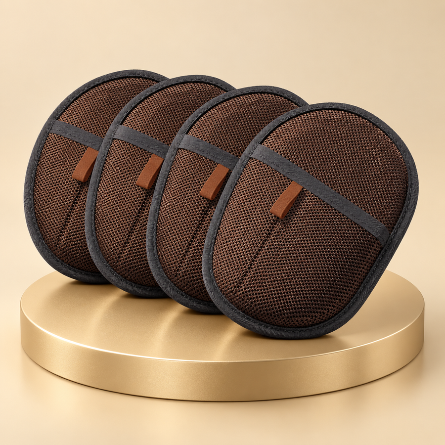 Four dark brown pet hair remover mitts in a row on a round champagne plinth